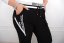 Čierne teplákové nohavice s vreckami a šnúrkou - Veľkosť: 44